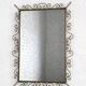 Rectangular mirror from the 50s-60s on a brass frame.