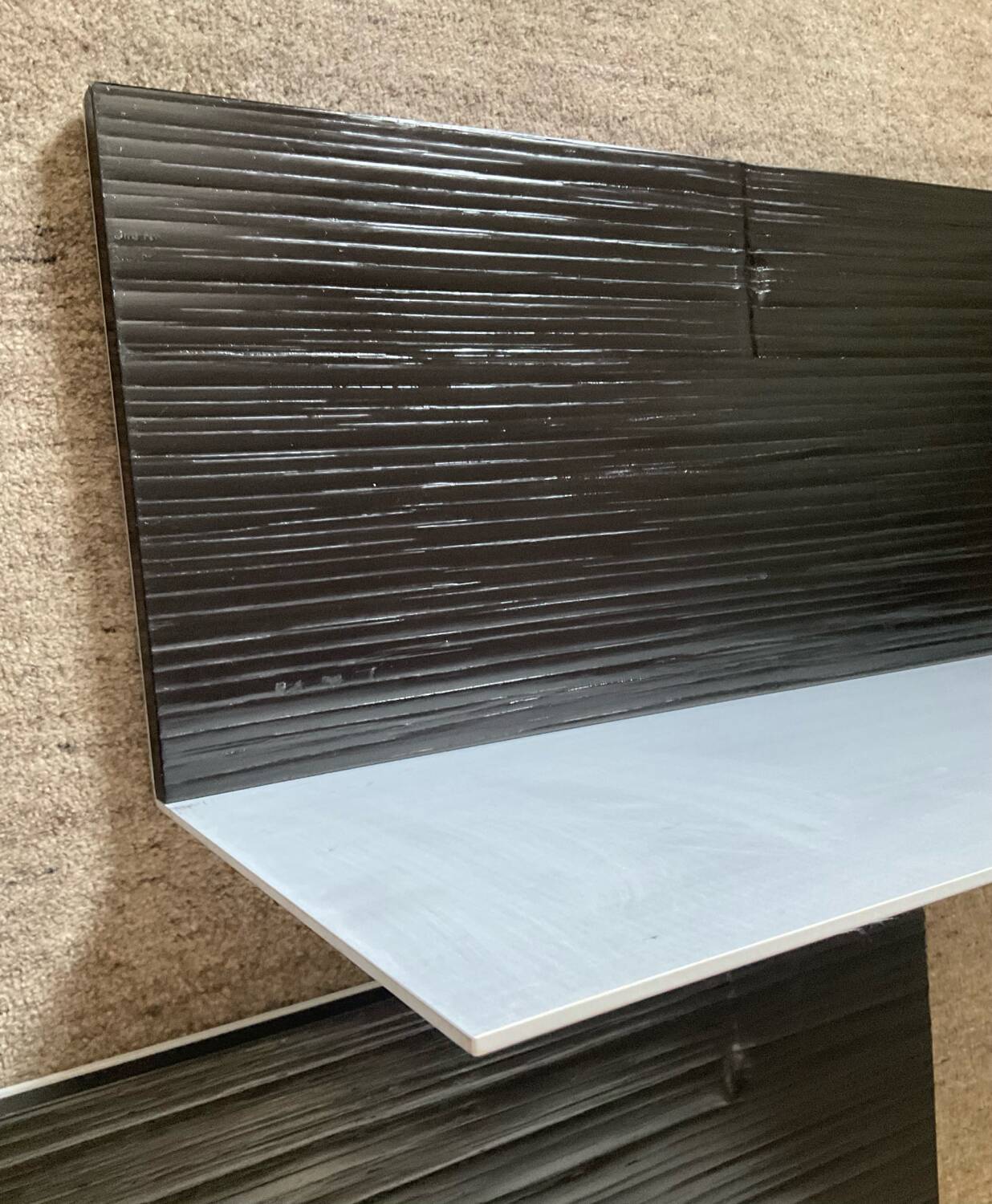 Pair of contemporary shelves in steel and stained wood