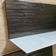 Pair of contemporary shelves in steel and stained wood