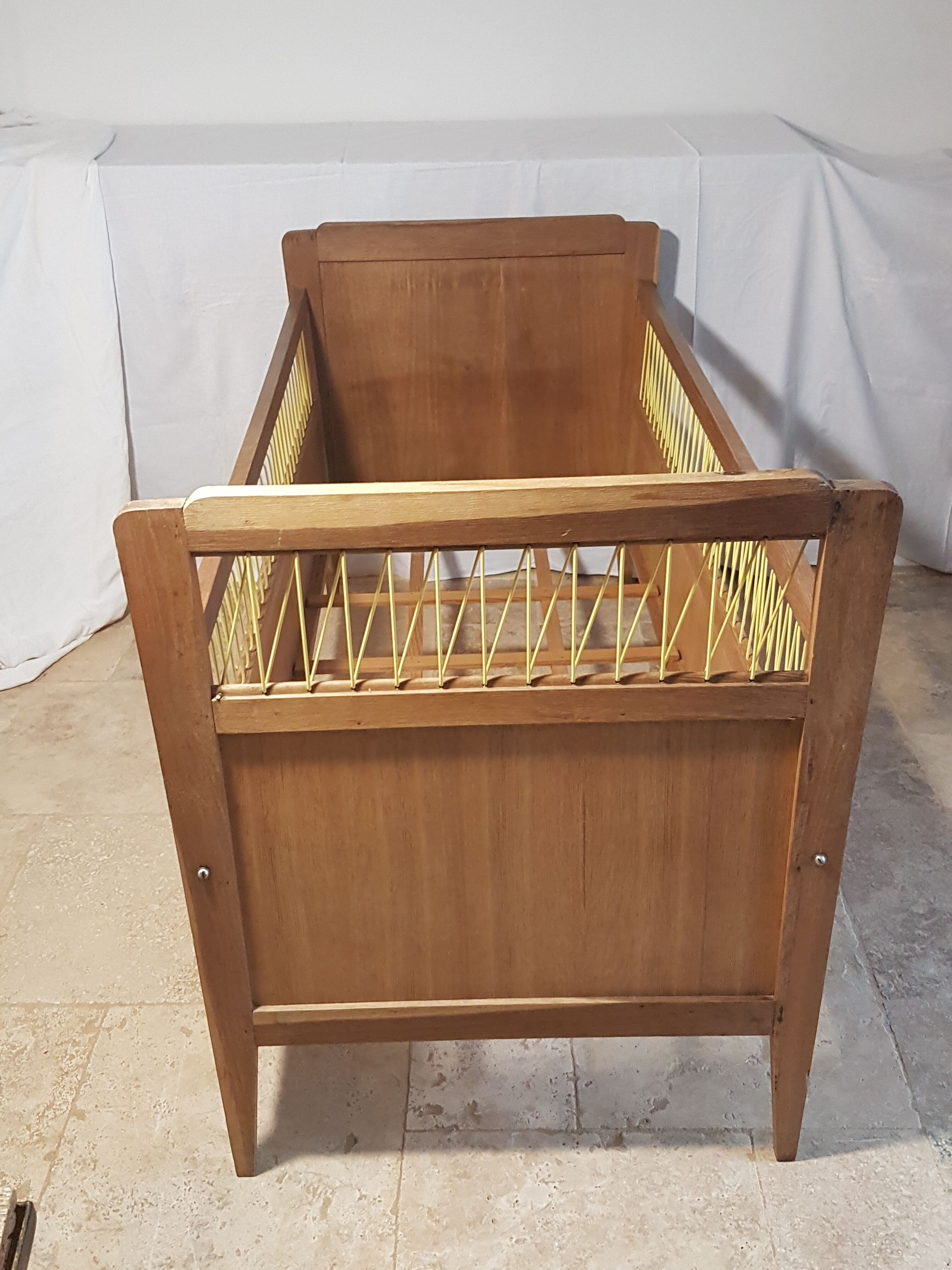 Children's bed made of wood and yellow scoubidou, 1950s.