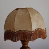 Table lamp in turned wood and umbrella-style leather lampshade