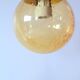 Set of 2 bubbled amber glass globe pendants