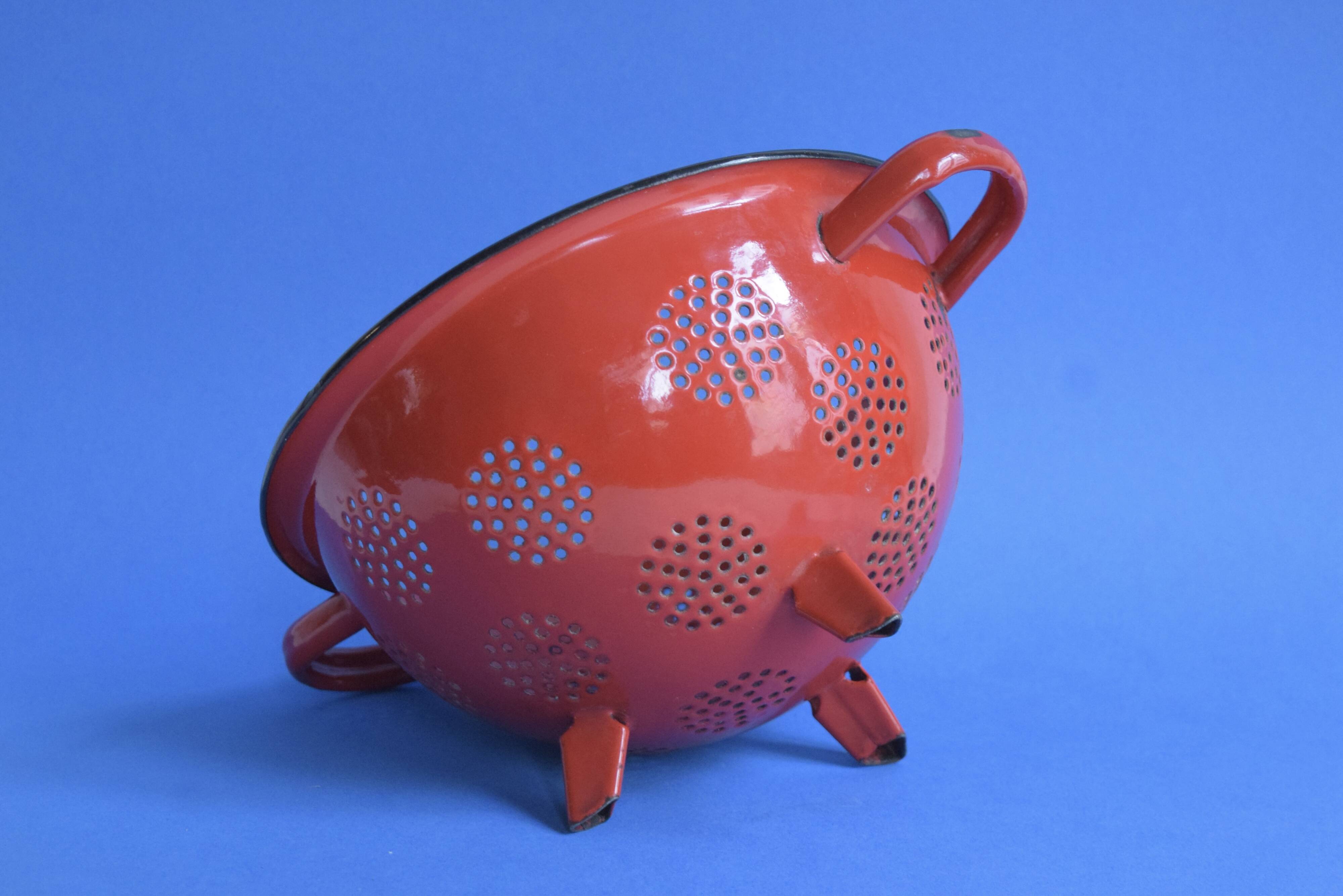 Vintage red enameled sheet metal colander