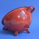 Vintage red enameled sheet metal colander