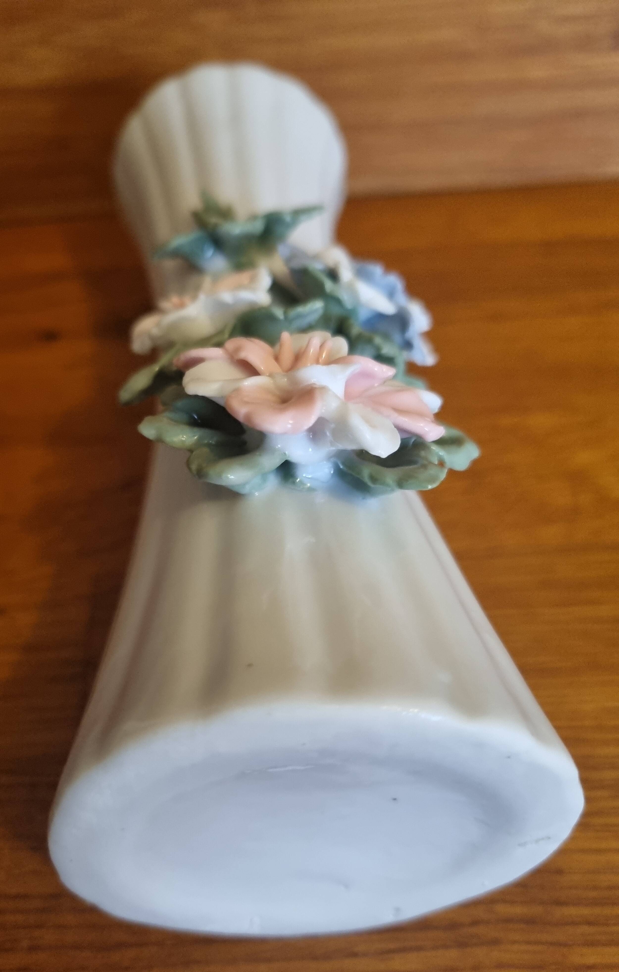 Porcelain vase with flowers in relief