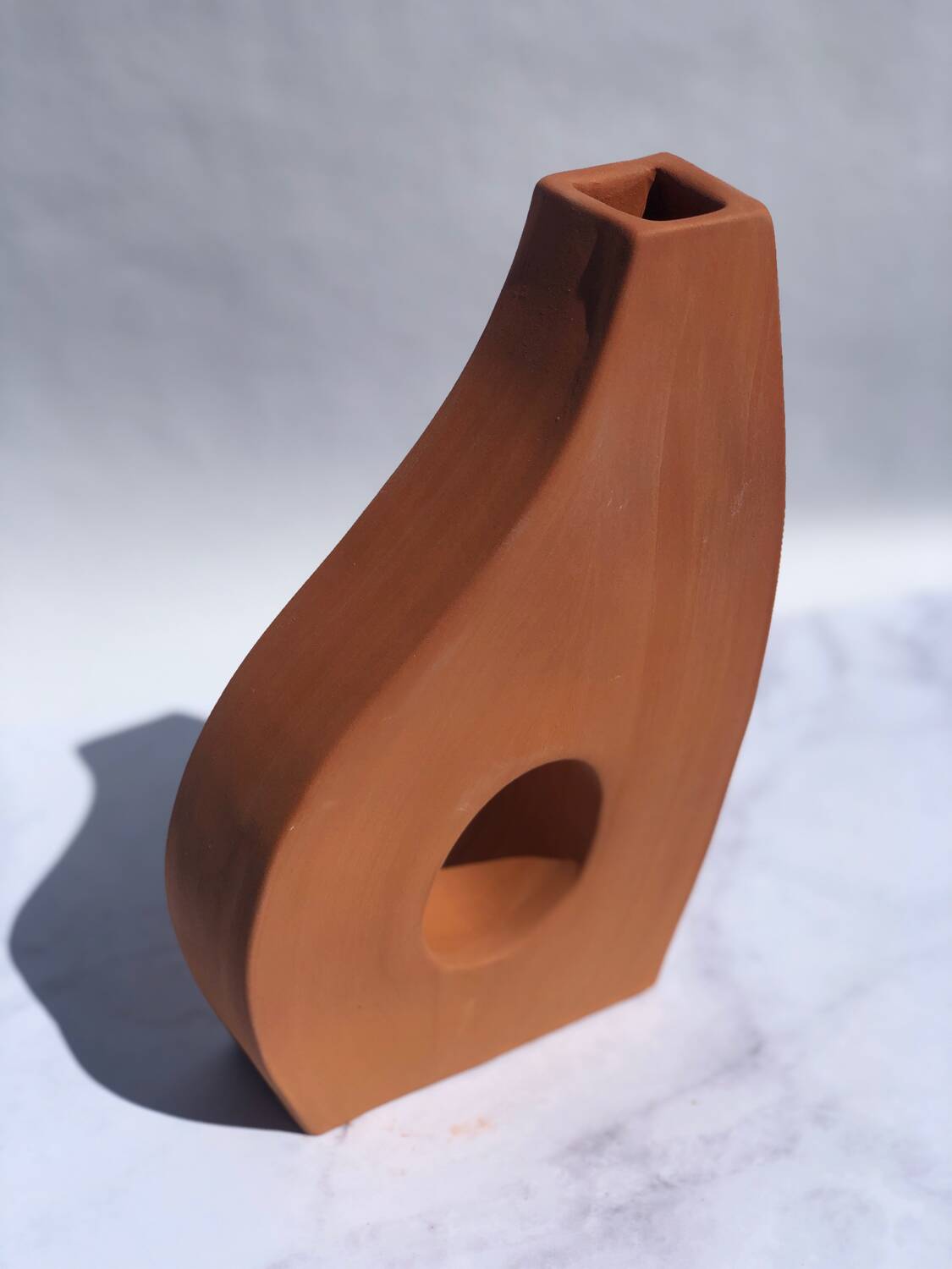 Handmade red earthenware flat vase