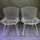 Pair of white lacquered Bertoia chairs