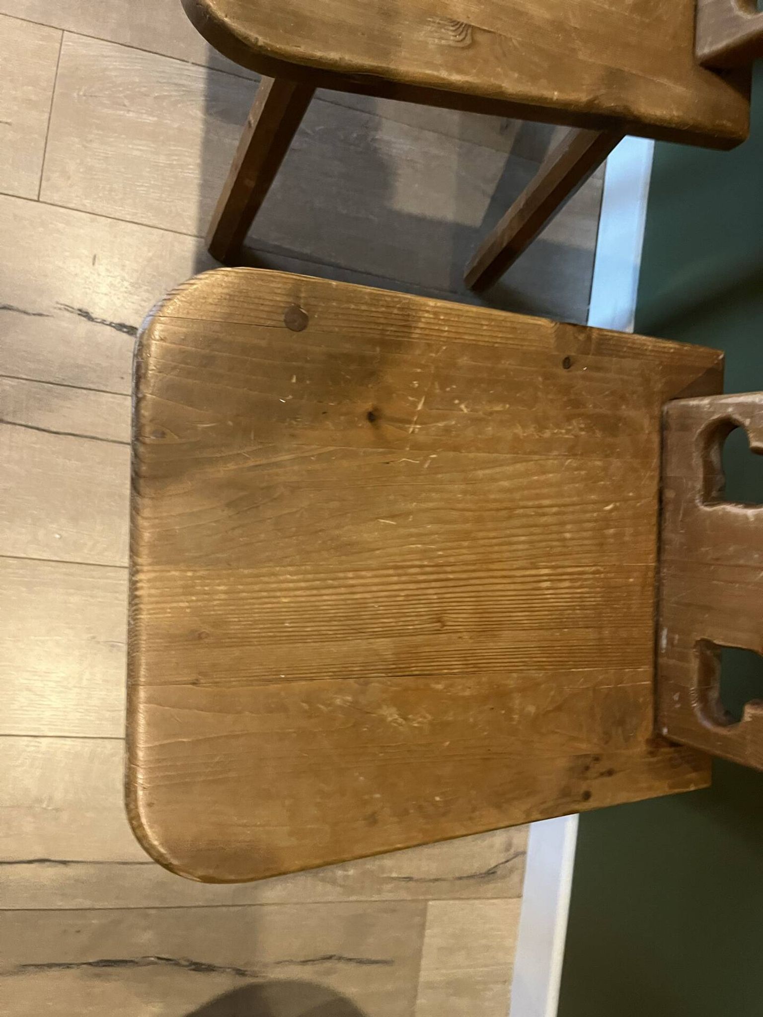 Pair of vintage wooden chairs in alpine chalet style.