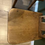 Pair of vintage wooden chairs in alpine chalet style.