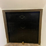 Marble fireplace surround with closed hearth frame.