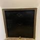 Marble fireplace surround with closed hearth frame.
