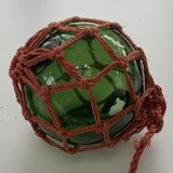 Globe, green glass float and vintage rope