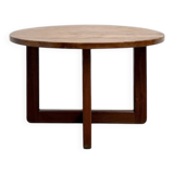 Modernist round table in solid elm, crossed legs.