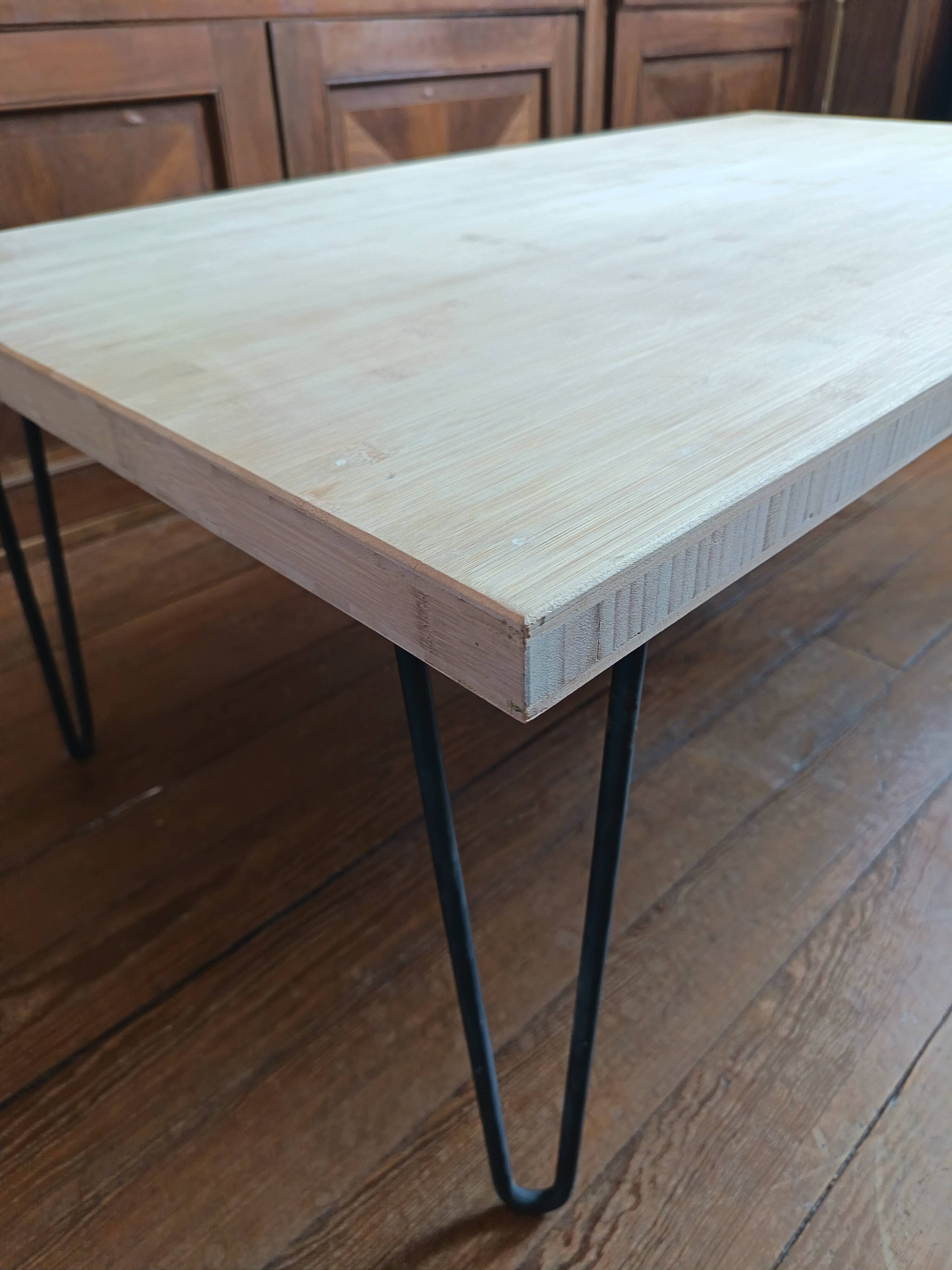 Coffee table in solid bamboo with steel legs.