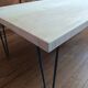 Coffee table in solid bamboo with steel legs.