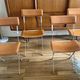 4 folding Sintesi chairs for DWR Lina in metal and vintage camel leather.