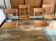 4 folding Sintesi chairs for DWR Lina in metal and vintage camel leather.