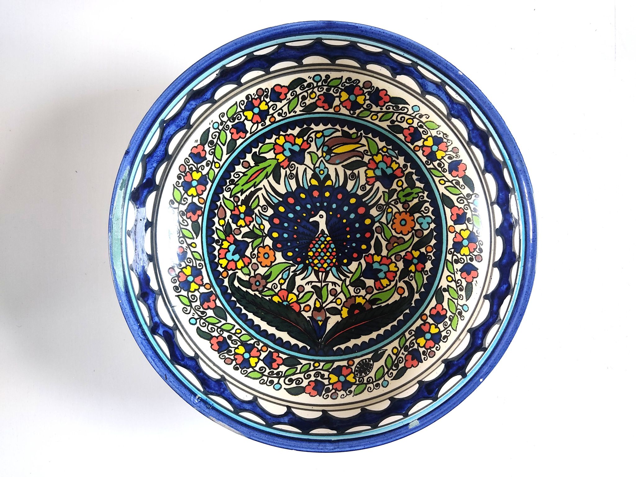 Large decorative dish with colorful peacock