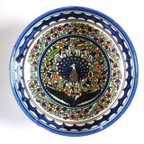 Large decorative dish with colorful peacock