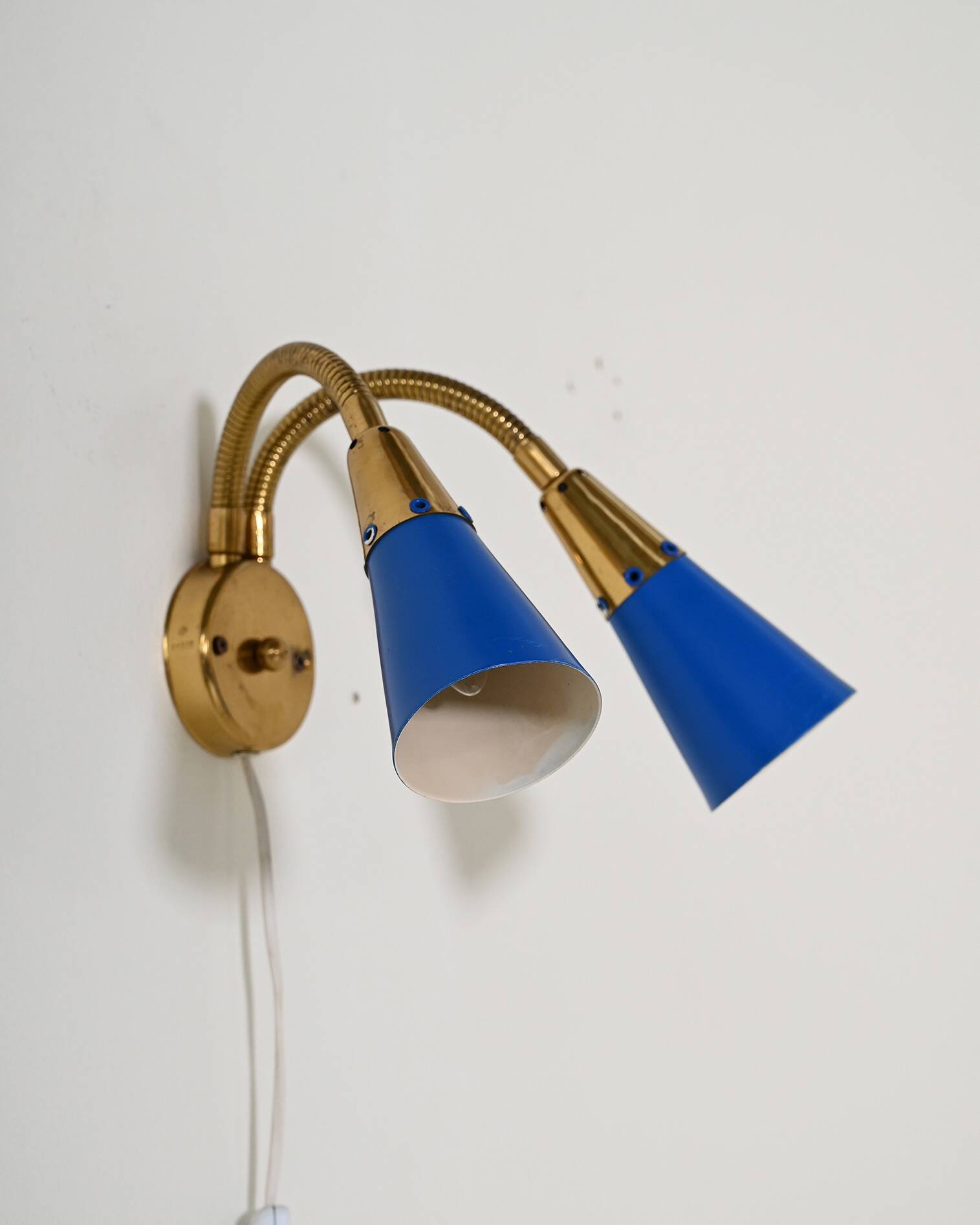 Adjustable brass and lacquered metal wall lamp, Scandinavia, 1960s