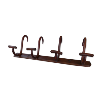 Coat rack with four double curved wooden pads