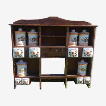 Small shelf with earthenware spices and wood