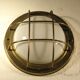 Brass "porthole" wall lamp
