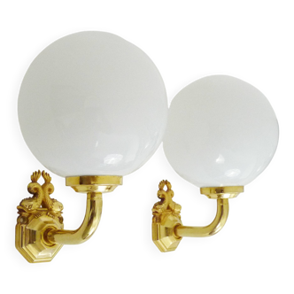 Pair of wall sconces with carp fish, brass and opaline globe.
