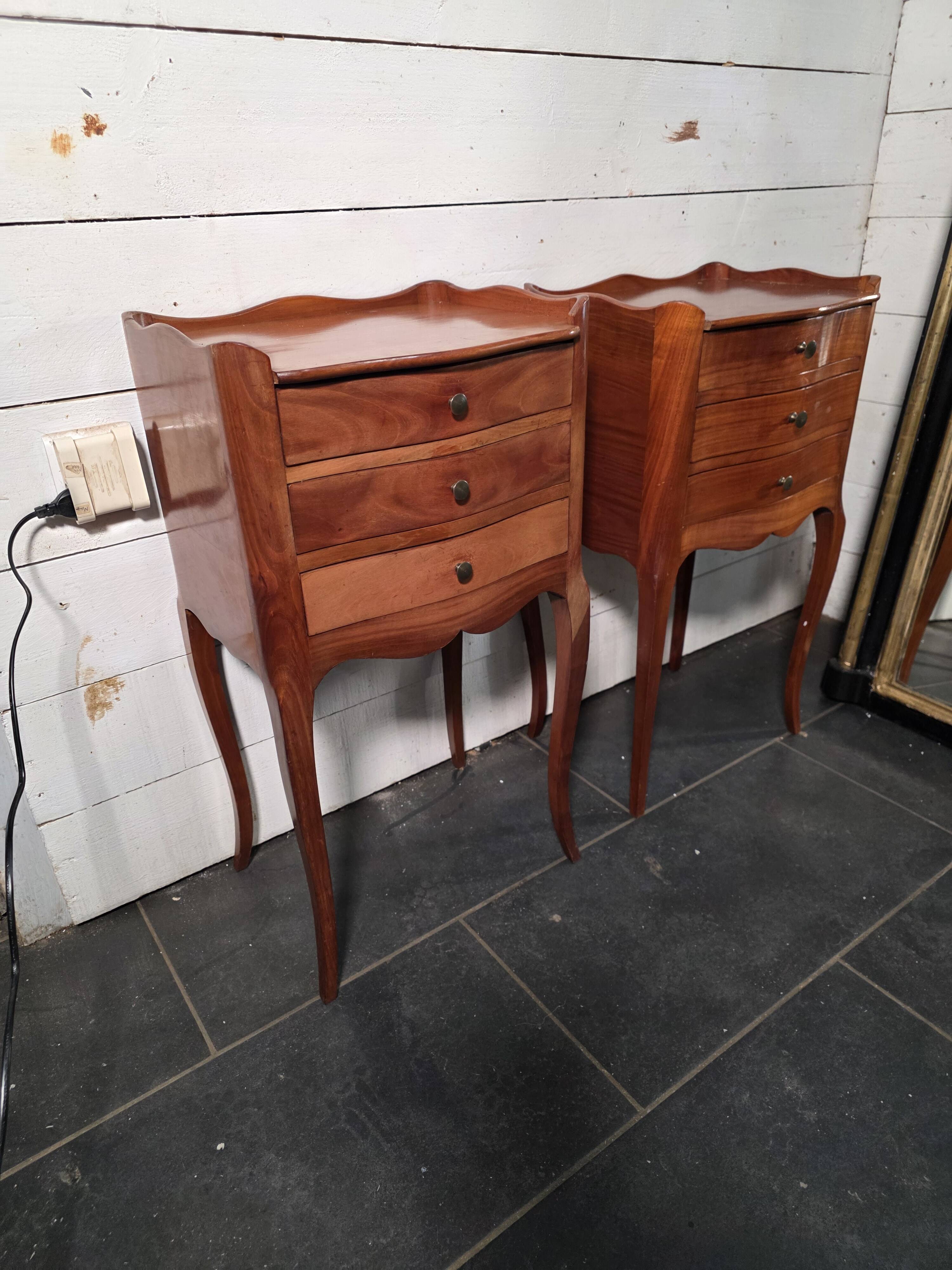 Pair of Louis XV style bedside tables in cherry wood.