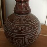 Vase in earth baked ethnic graphic patterns