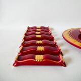 set of trivets, bottle coasters and knife holders in art de cherry-colored ceramic