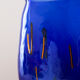Blue blown glass vase and orange inclusion