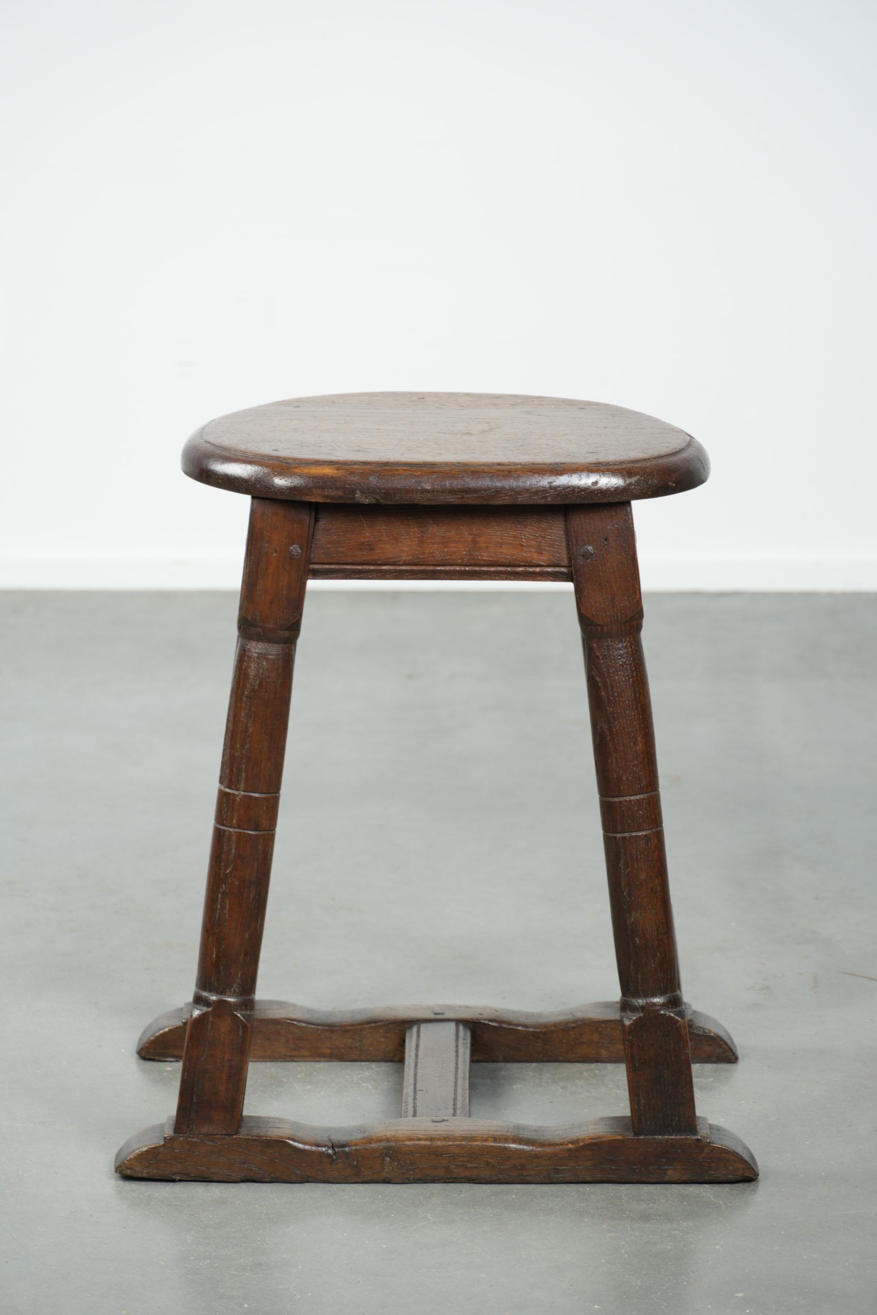 Antique Dutch oak stool from the early 19th century with a nice design