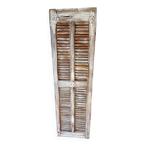 Vintage shutter renovated into a coat rack