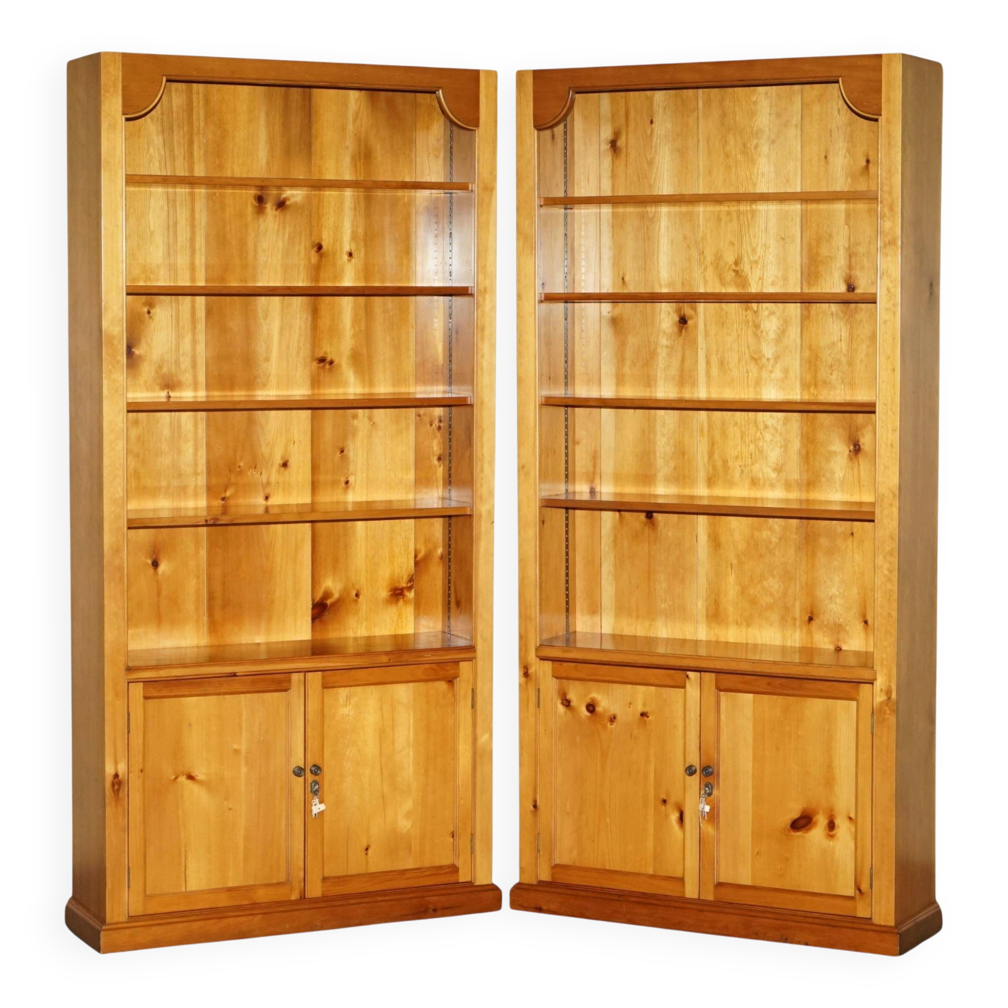Pair of vintage cherry wood bookcases with lockable doors.