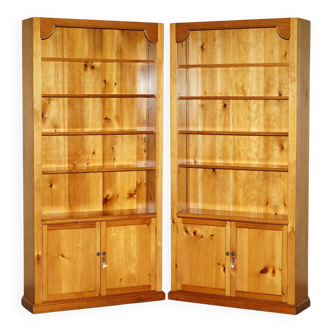 Pair of vintage cherry wood bookcases with lockable doors.