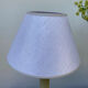Beige ceramic lamp and iridescent white lampshade