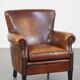 Sheepskin armchair/lounge chair finished with decorative nailheads