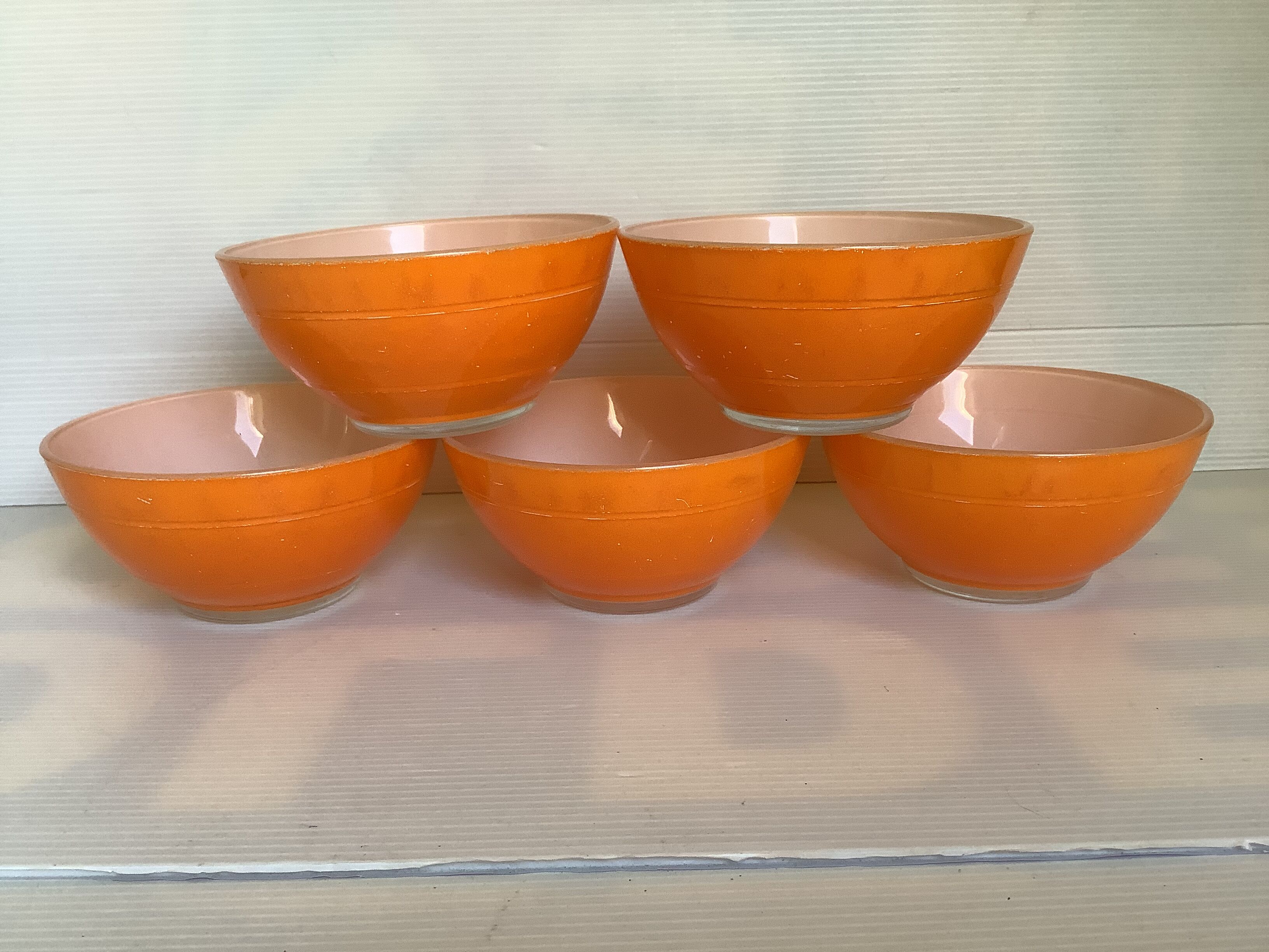 Five old orange duralex bowls