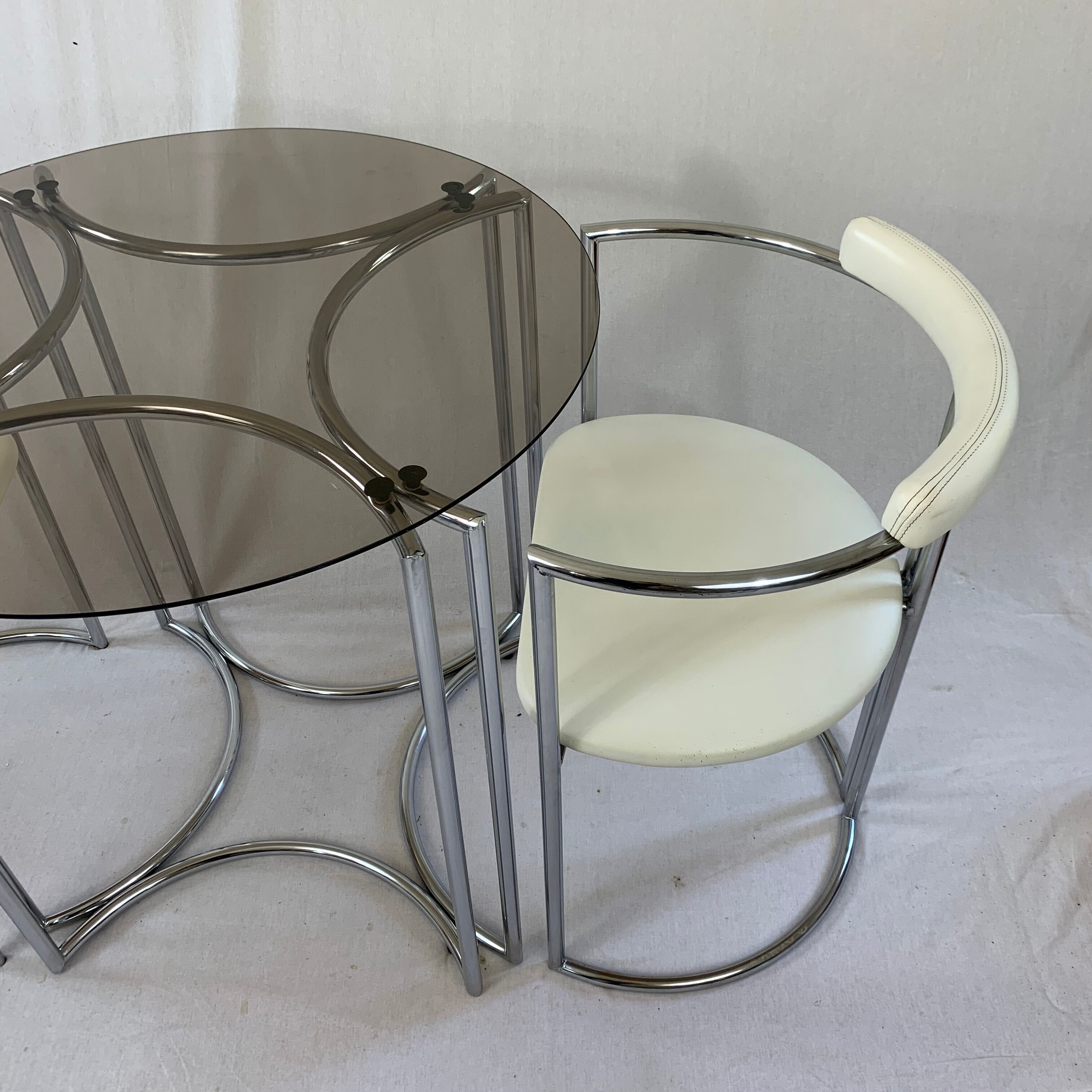 Chrome table and two modernist chairs