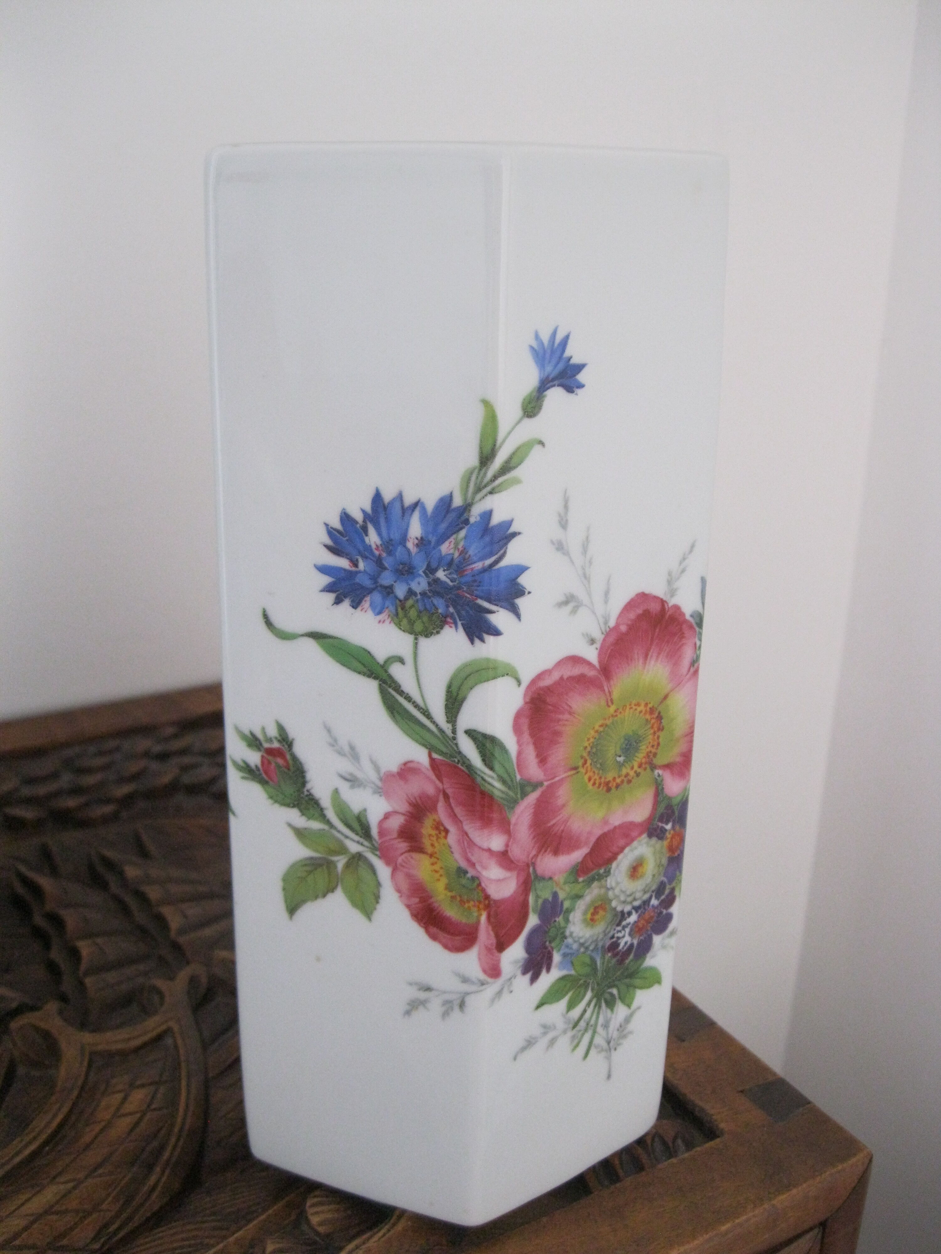 Flowery white porcelain faceted vase