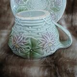 Antique cup and saucer in majolica.