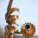 Applies "wheat sheaf" gold metal