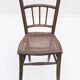 Chair with a slatted backrest and caned seat.