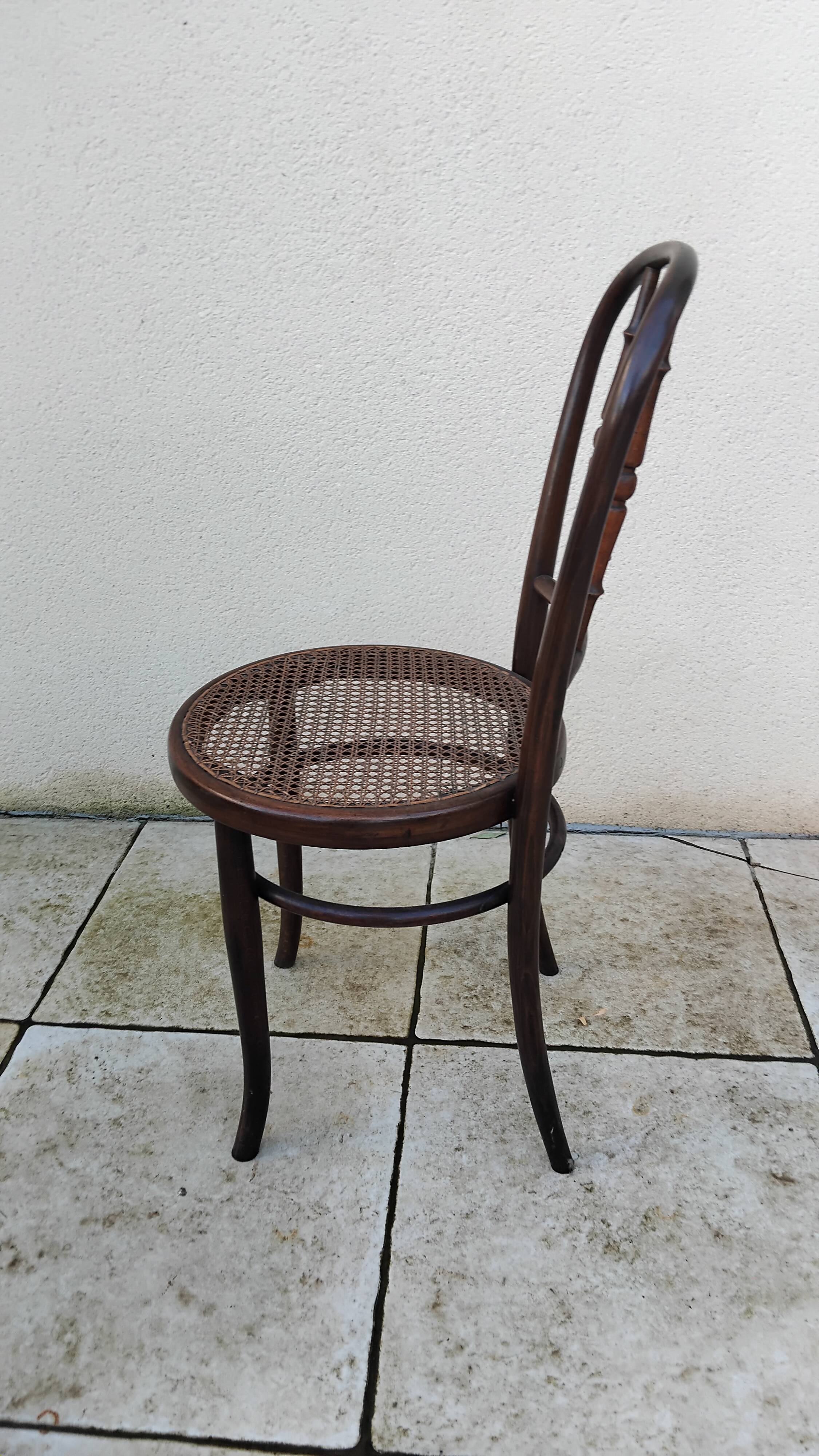 Old caned bistro chair fischel