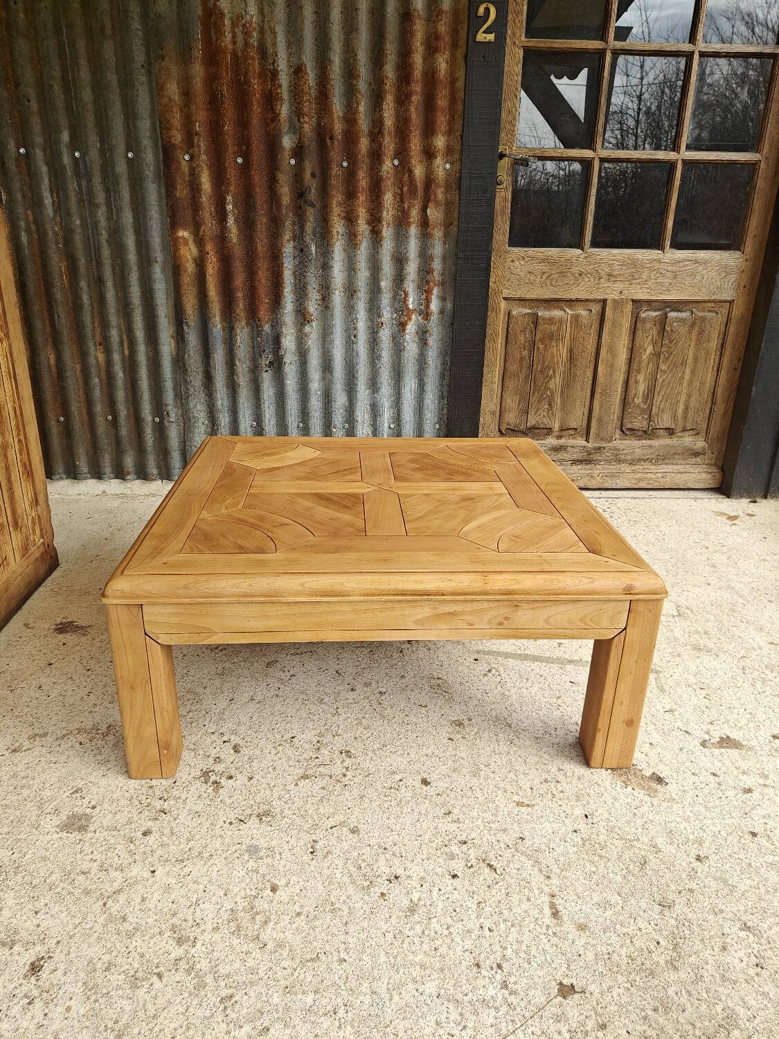 Square coffee table with a drawer in cherry wood.
