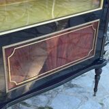 Mahogany display case with gilded brass decoration