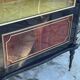 Mahogany display case with gilded brass decoration