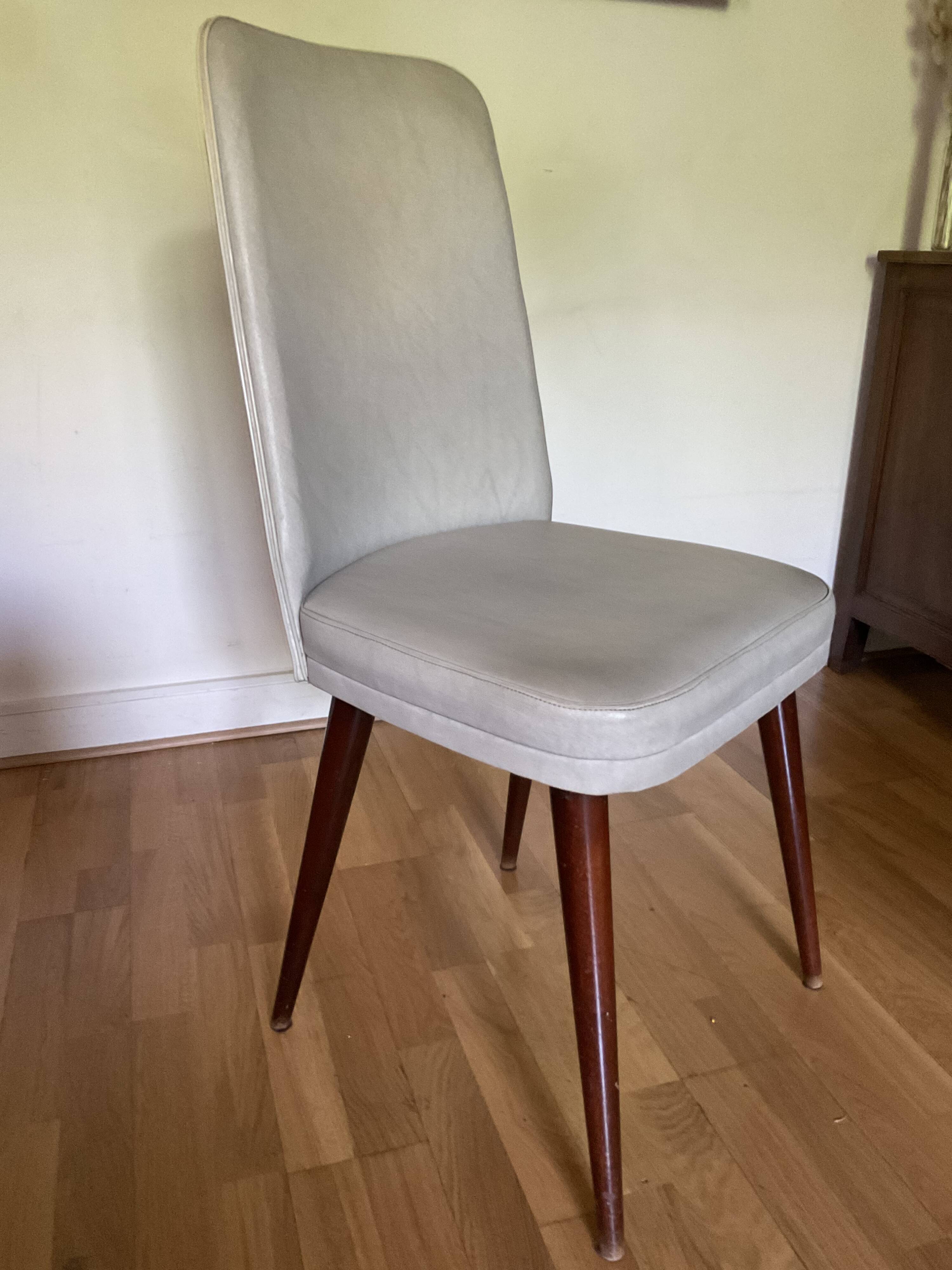Pair of vintage mahogany and skai chairs
