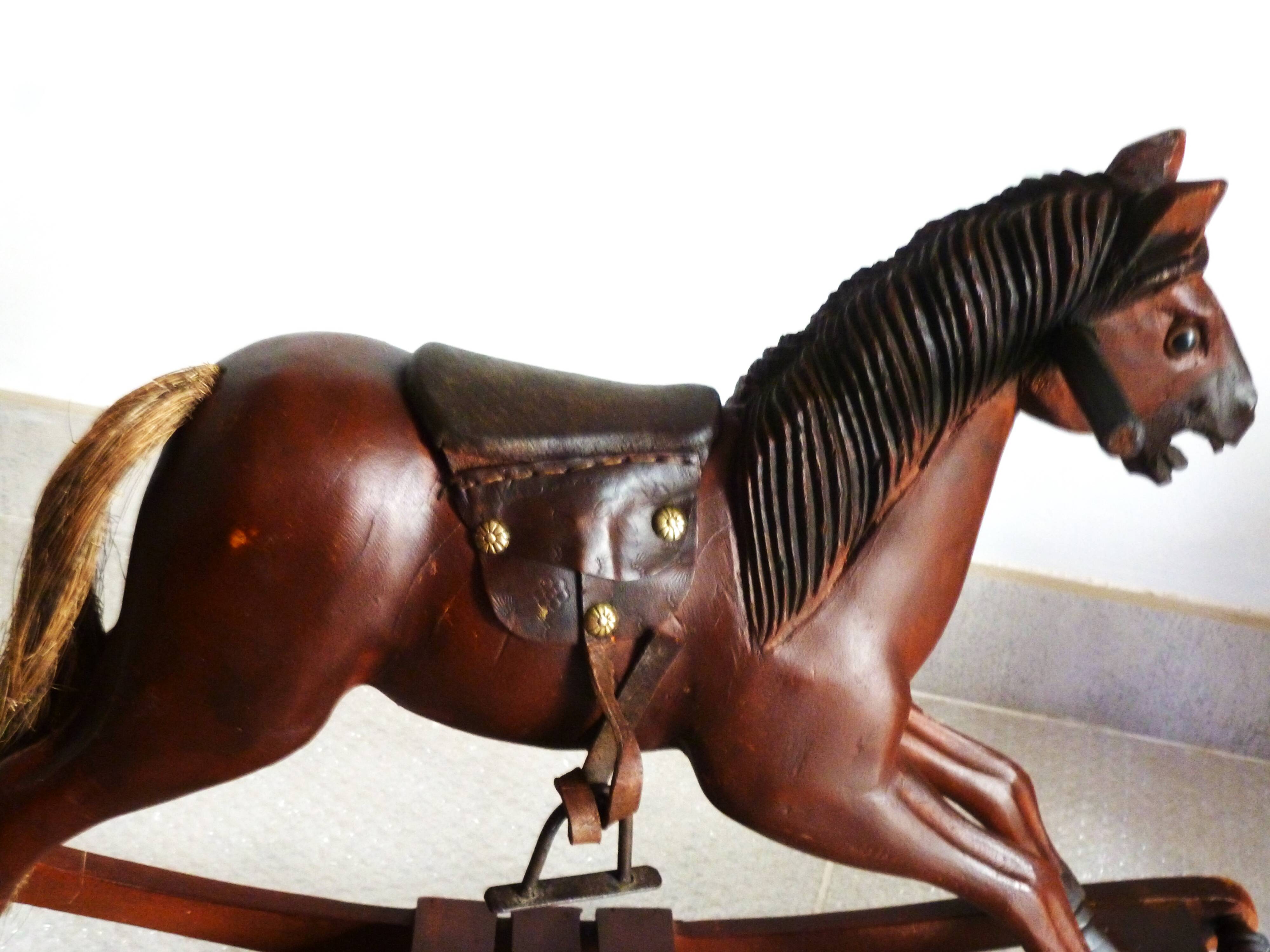 Antique wooden and leather rocking horse